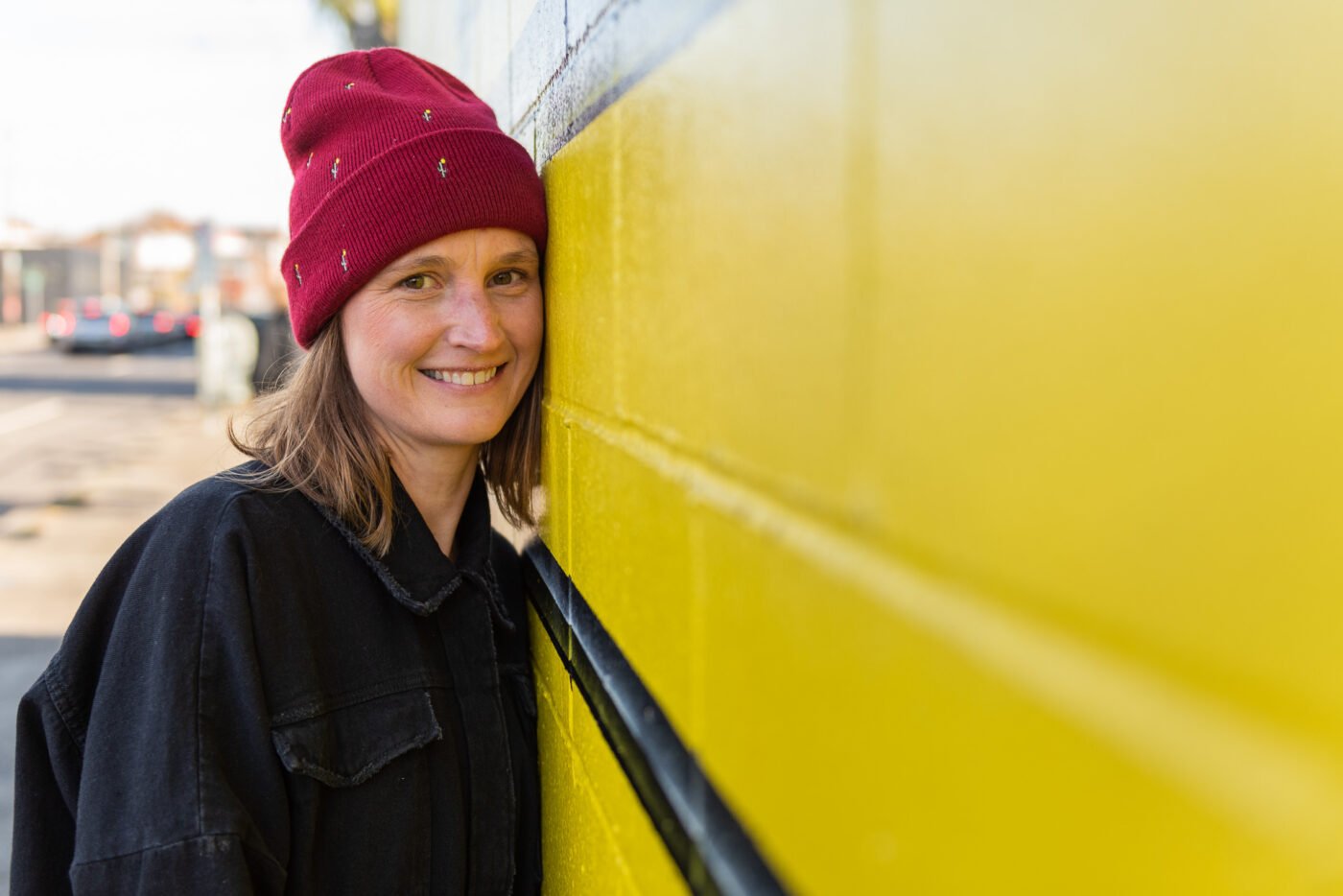 anika-cheek-on-yellow-wall
