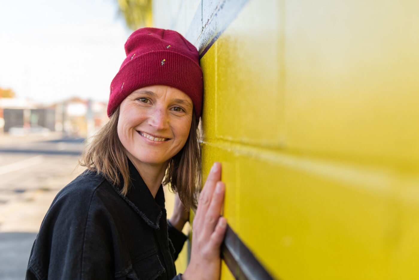 anika-cheek-on-yellow-wall-2
