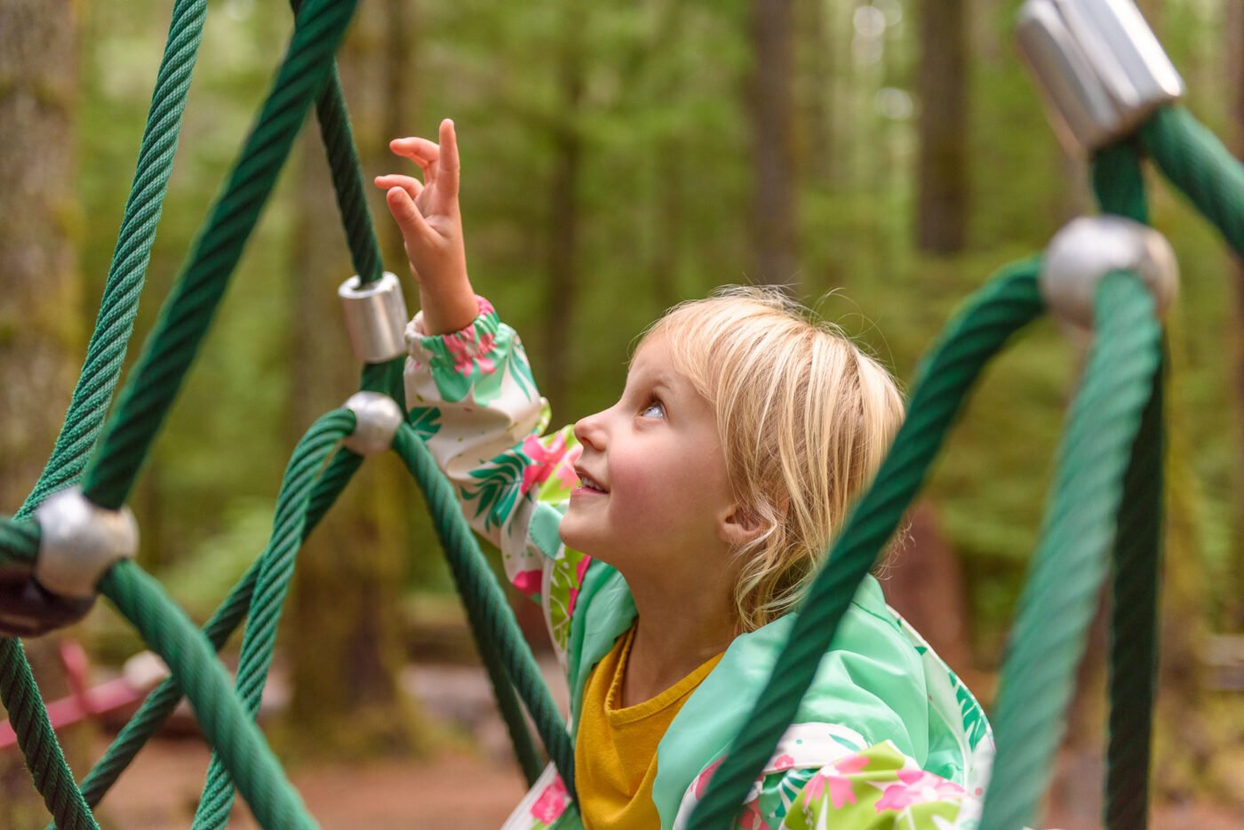 girl-pointing-up-at-play-structure