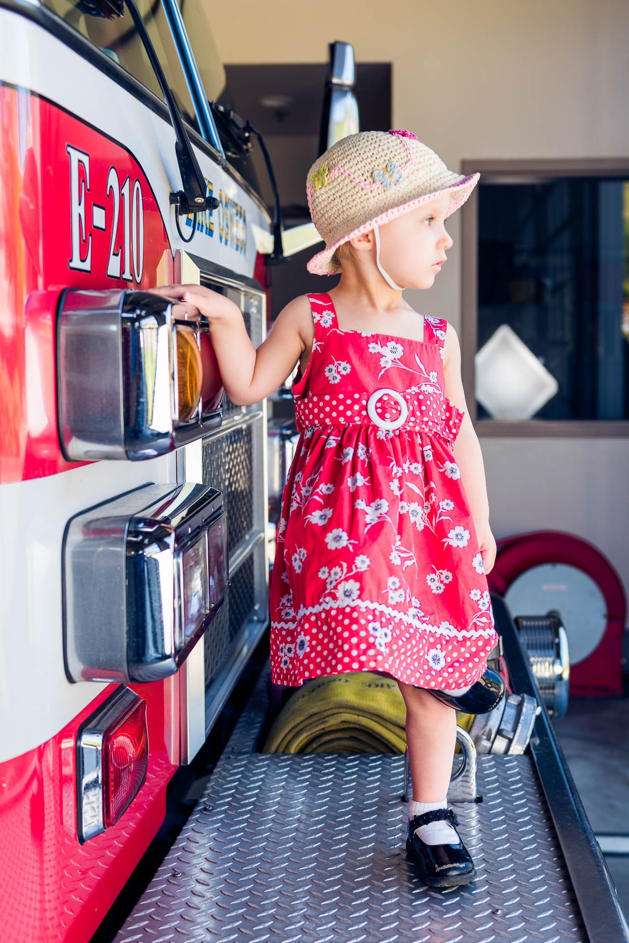 girl-looking-sideways-fire-truck girl-looking-sideways-fire-truck