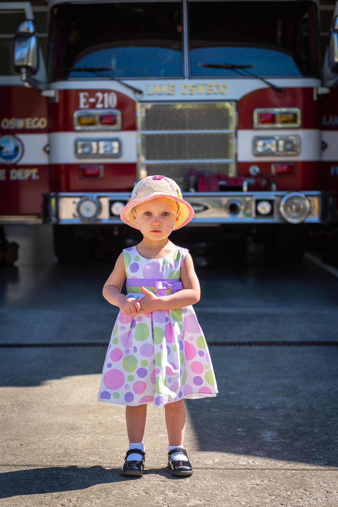 girl-serious-face-fire-truck girl-serious-face-fire-truck